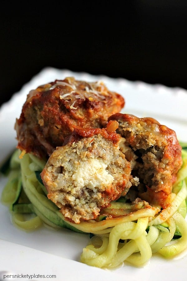 Slow Cooker Cheese Stuffed Turkey Meatballs with Zoodles on a plate close up of the inside.