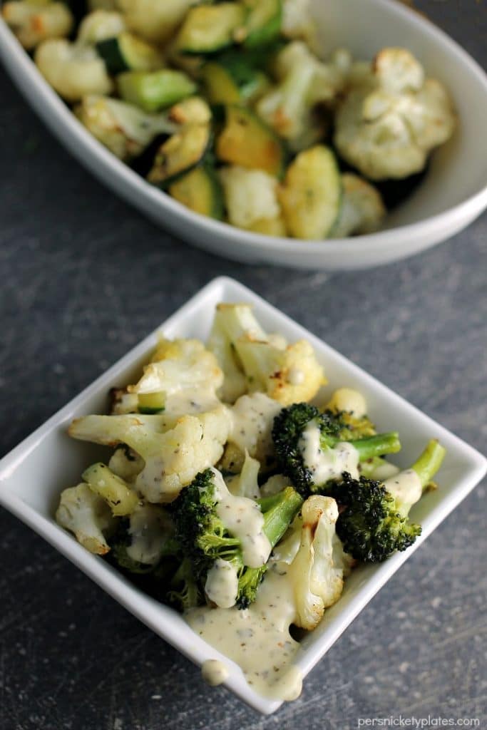 Simple blend of roasted broccoli, cauliflower, and zucchini flavored with dollops of Marzetti Lemon Basil finishing sauce. | Persnickety Plates AD
