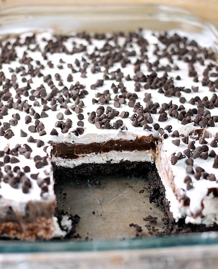 Chocolate lovers rejoice! This no bake Chocolate Lush is filled with cream cheese, chocolate pudding, and chocolate chips on top of an Oreo cookie crust! | Persnickety Plates
