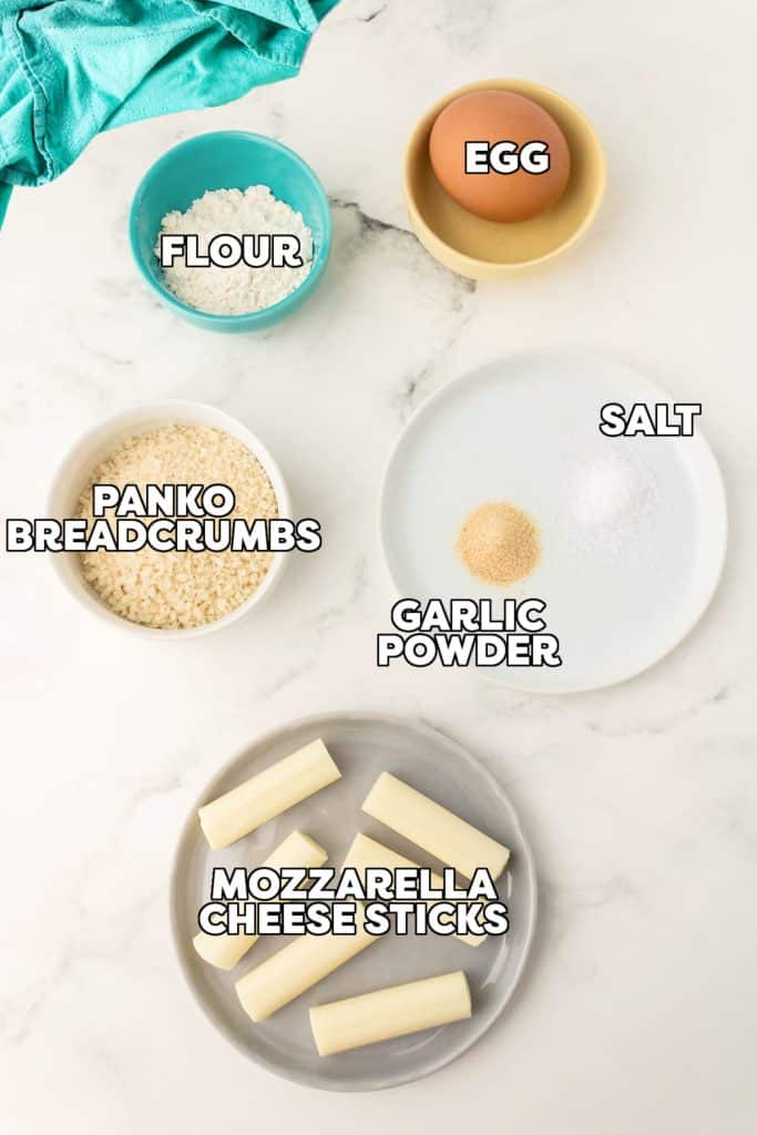 overhead shot of labeled ingredients laid out to make air fryer mozzarella sticks.