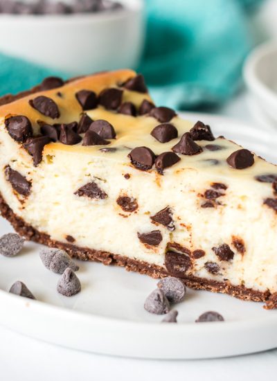 slice of chocolate chip cheesecake on a white plate.