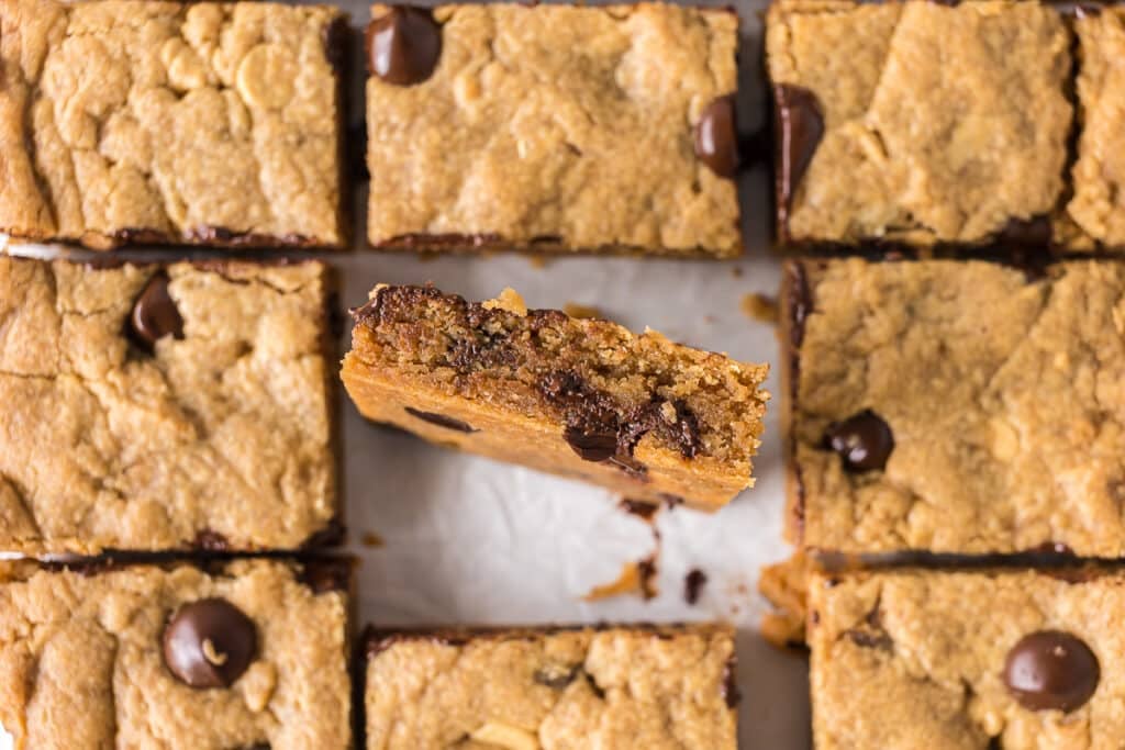 sliced peanut butter blondies with one turned on its side.