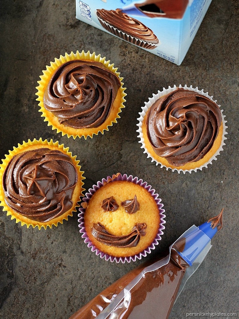 Cheesecake Filled Cupcakes are super simple starting with a cake mix but filled with chocolate chip cheesecake mixture in the centers! | www.persnicketyplates.com