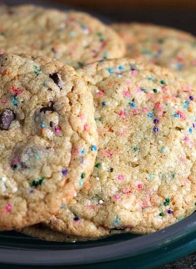 These Perfect Party Cookies start with a cake mix and are full of chocolate chips and sprinkles. Mix up the colors to suit whatever type of party you're having! | Persnickety Plates