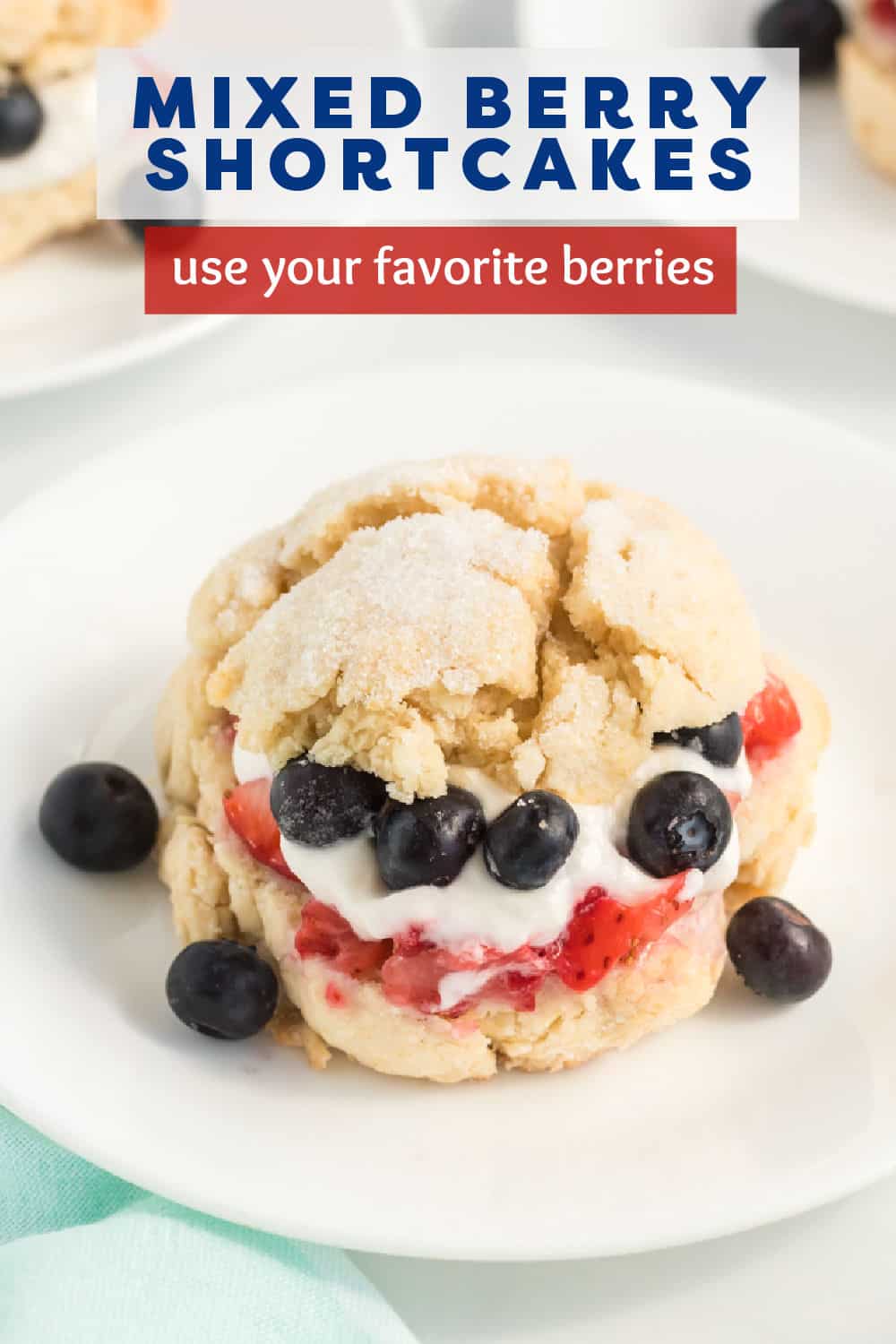Mixed Berry Shortcakes take sweet, buttery shortcakes topped with homemade whipped cream and stuffed with ripe, fresh, juicy strawberries and blueberries. This lightly sweetened dessert recipe is perfect for any occasion. | www.persnicketyplates.com