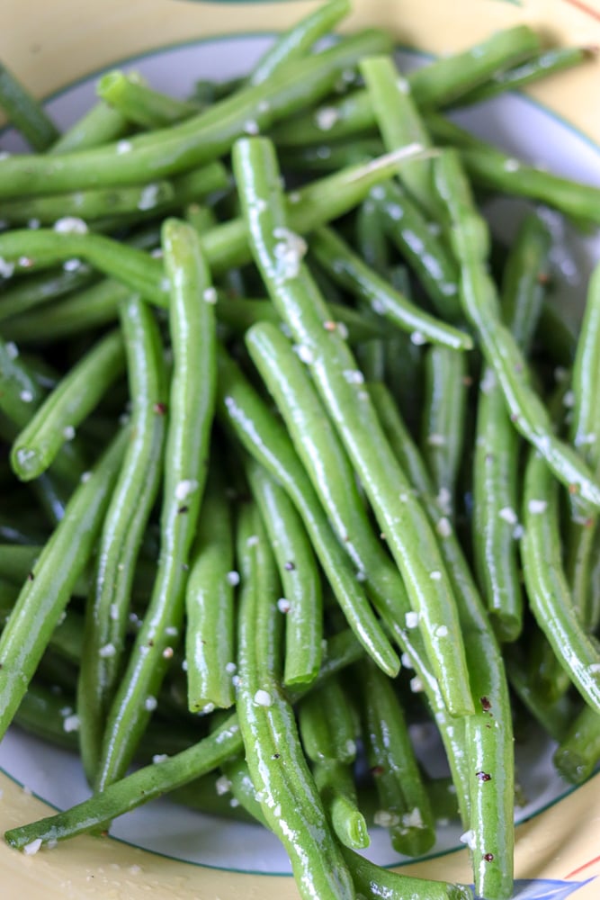 garlic green beans prepped in a bowl with garlic