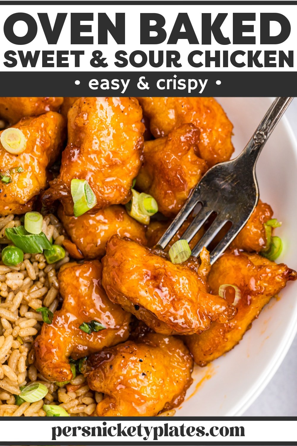Baked sweet and sour chicken is made with a light crispy coating smothered in a sweet, sour, and slightly sticky sauce and baked until perfectly crisped on the outside and tender on the inside. Serve with your favorite sides and have delicious take-out without leaving home! | www.persnicketyplates.com
