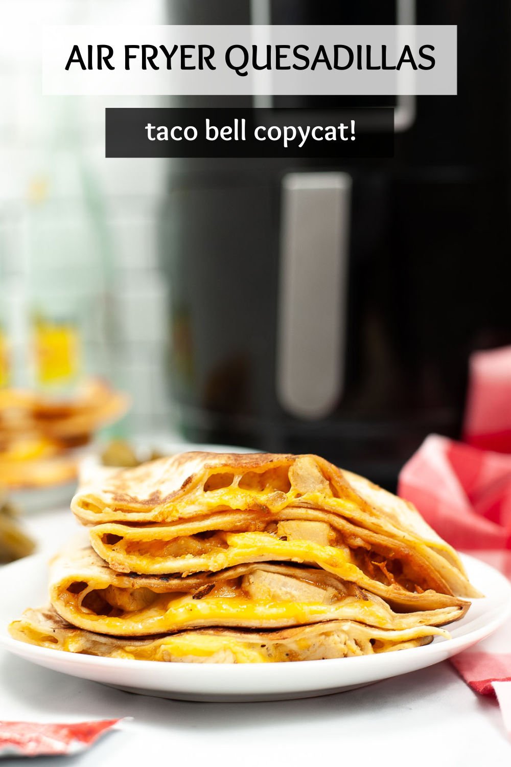 This air fryer quesadilla filled with chicken and copycat Taco Bell quesadilla sauce is a quick and easy dinner idea. Making them in the air fryer leaves the tortilla perfectly crisp and the cheese nice and melty. | www.persnicketyplates.com