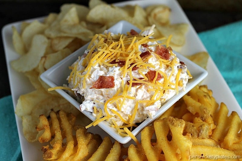 Loaded Baked Potato Dip only has three ingredients and is perfect for game day snacking. If you love loaded baked potatoes, you'll love dipping your chips or potato wedges into this simple dip! | www.persnicketyplates.com