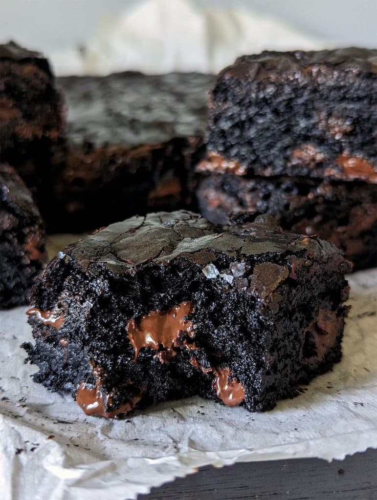 dark chocolate brownie with a bite missing.