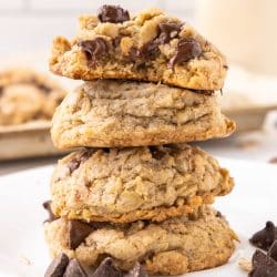 stack of oatmeal chocolate chip cookies with melty chocolate chips.