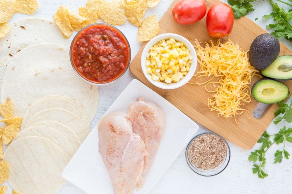Three ingredient Crock Pot Salsa Chicken is in my regular dinner rotation because it's so easy & so good! Flavorful and versatile, this crockpot chicken breast recipe can be made into burritos, taco bowls, nachos, whatever you feel like!
