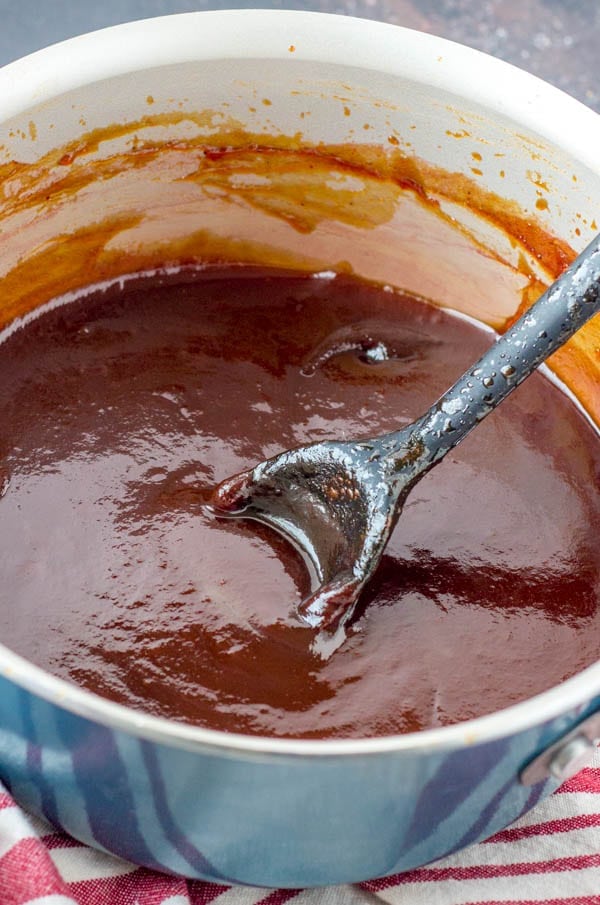 pot of copycat kfc honey bbq sauce with spoon
