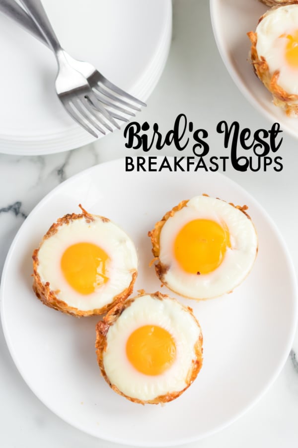 overhead shot of bird's nest breakfast cups on white plate with forks