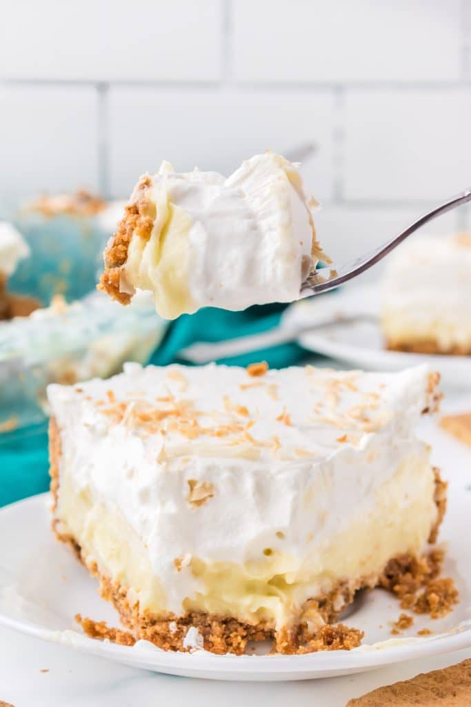 bite of coconut cream pie on a fork.
