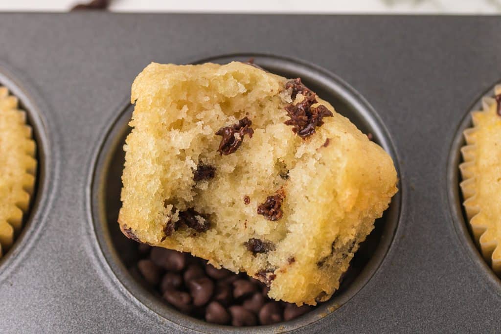 overhead shot of chocolate chip muffin with a bite missing.