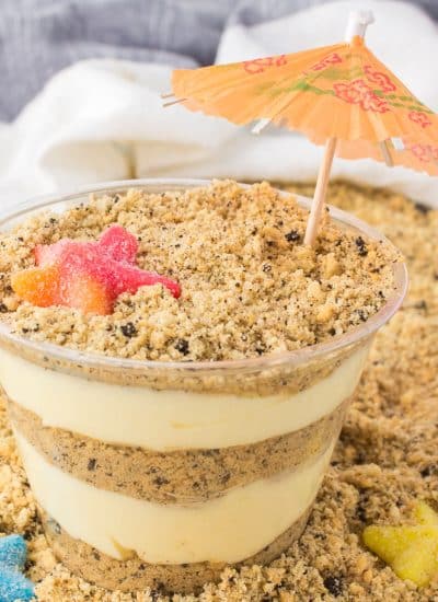 layered sand pudding cup with a drink umbrella.