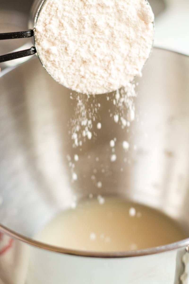 flour pouring into mixing bowl