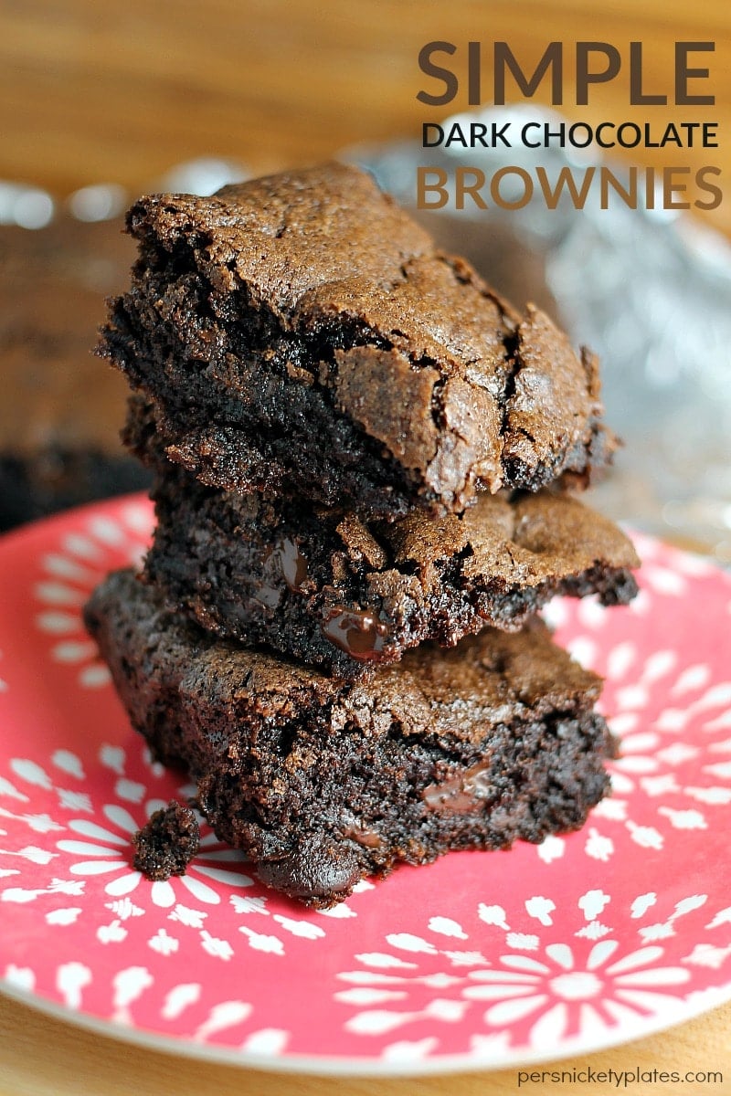 This super simple dark chocolate brownie recipe is rich and chocolatey with a perfect flaky crust and they whip up in no time. Made from scratch with cocoa, this quick recipe will become a favorite! | www.persnicketyplates.com