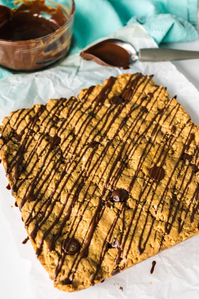 chocolate drizzle over oatmeal bars.