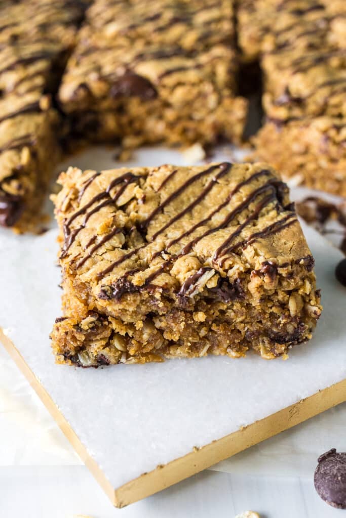 oatmeal peanut butter bar topped with chocolate.