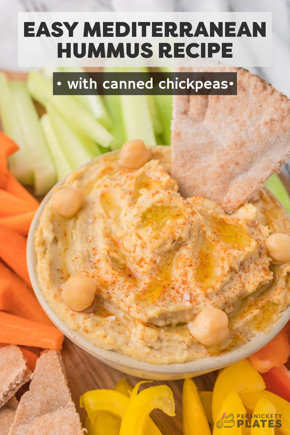 Thick and creamy, this Mediterranean Hummus recipe is loaded with flavor and ideal to eat with your favorite dippers like fresh veggies and your favorite crackers or pita bread. A staple in the Middle East, hummus is a healthy, versatile dip that comes together in just minutes with just a few basic ingredients. | www.persnicketyplates.com