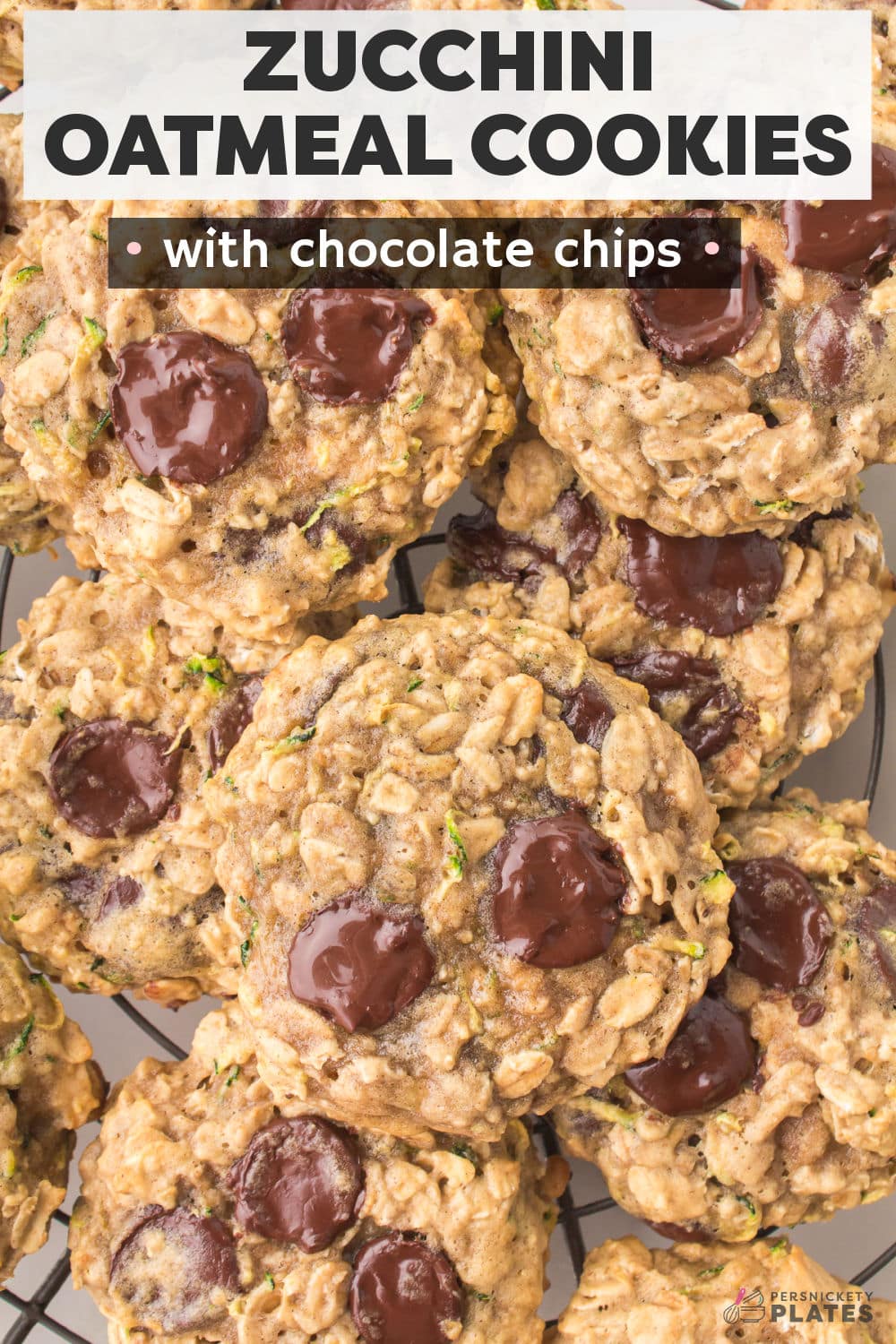 These Zucchini Oatmeal Cookies are soft, chewy, and full of chocolate chips! If you like zucchini bread, you're going to love when grated zucchini is hidden in your cookies. | www.persnicketyplates.com