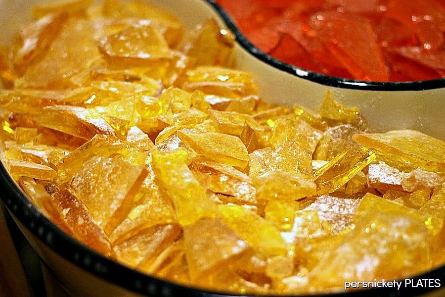 close up of candy dish with yellow and red homemade hard candy