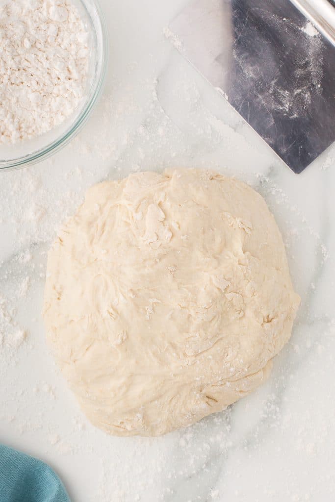 ball of dough on a floured surface.
