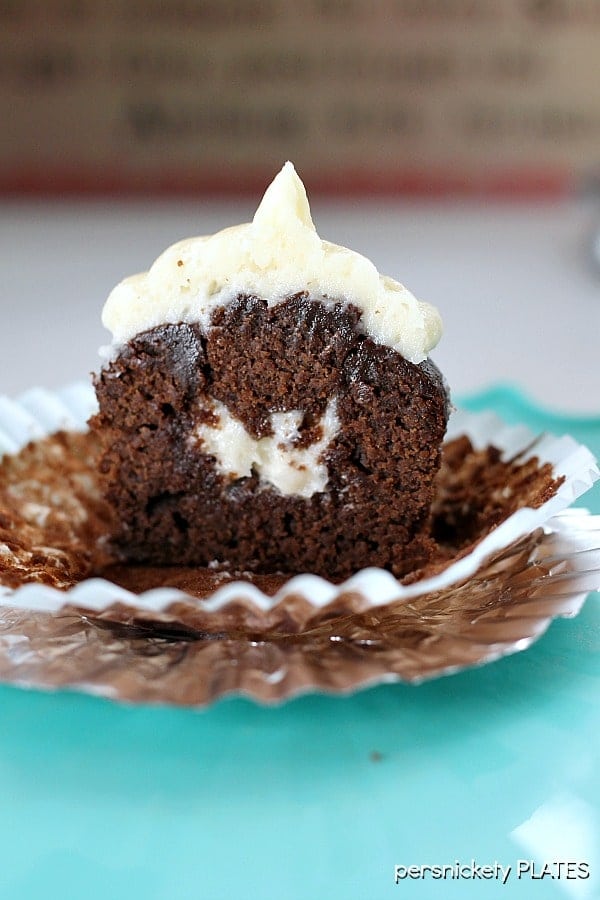 Chocolate Cupcakes Filled with Vanilla Buttercream are delicious, moist chocolate cupcakes topped stuffed and topped with a fluffy vanilla buttercream frosting. | Persnickety Plates