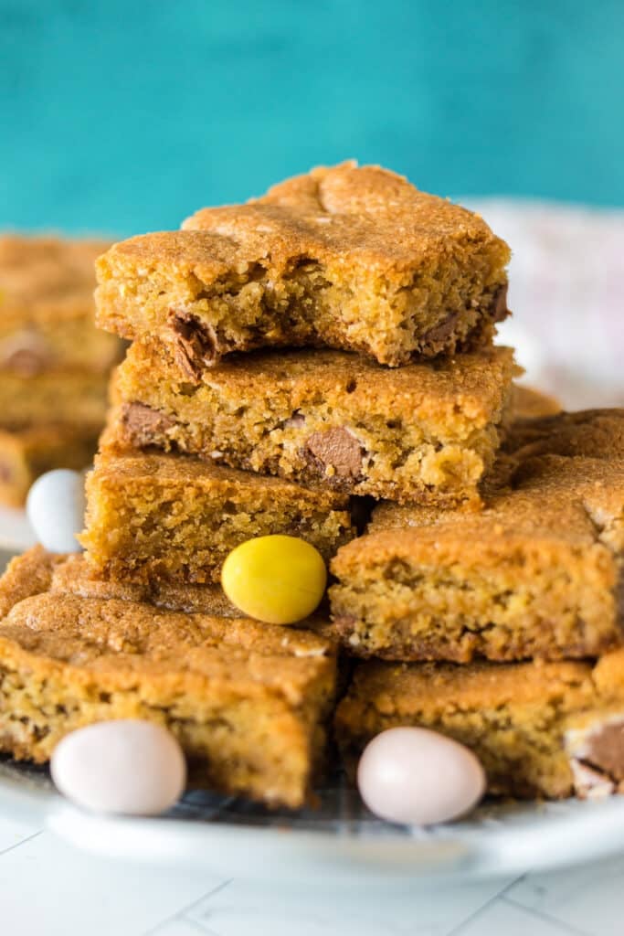 stack of cookie bars with cadbury mini eggs.
