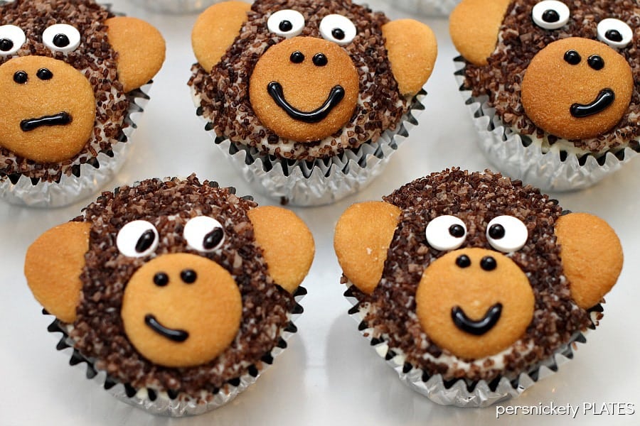 Monkey Cupcakes are such a cute dessert idea, you may not want to eat them! These delicious homemade chocolate cupcakes are made with chocolate sanding sugar and vanilla wafer ears! Perfect for a monkey themed birthday party!