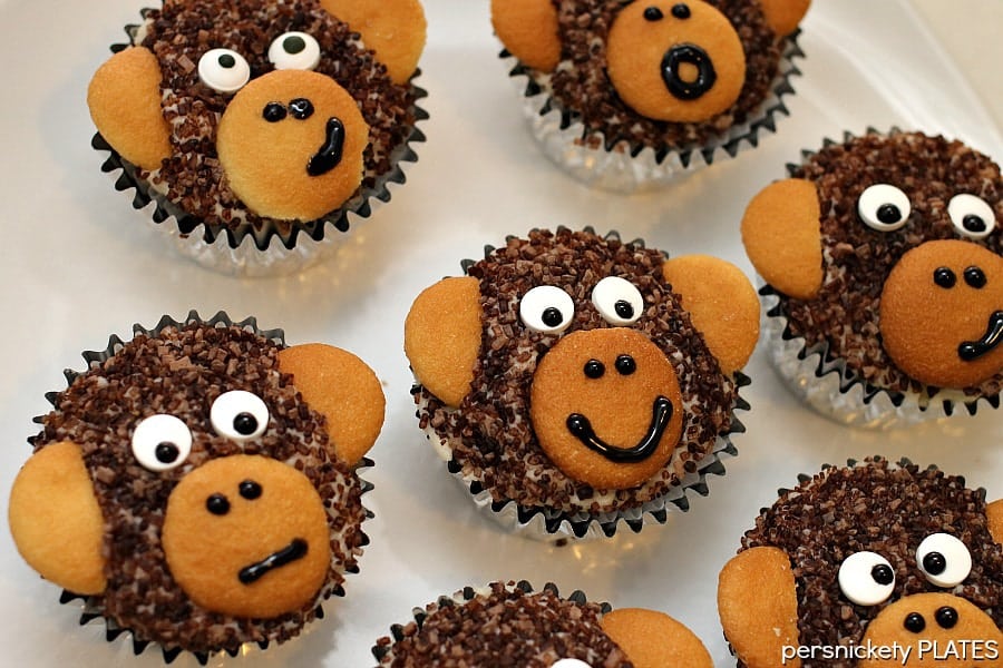 Monkey Cupcakes are such a cute dessert idea, you may not want to eat them! These delicious homemade chocolate cupcakes are made with chocolate sanding sugar and vanilla wafer ears! Perfect for a monkey themed birthday party!