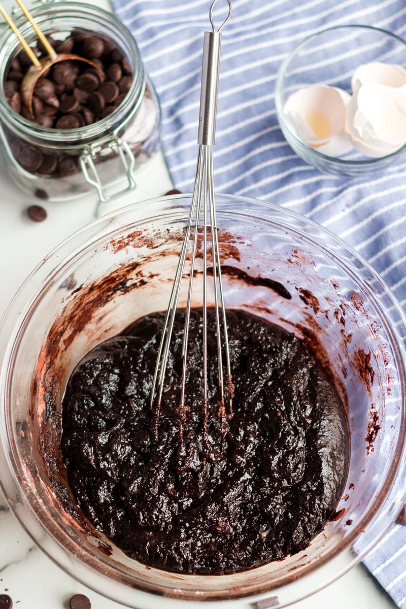 brownie batter in mixing bowl with whisk