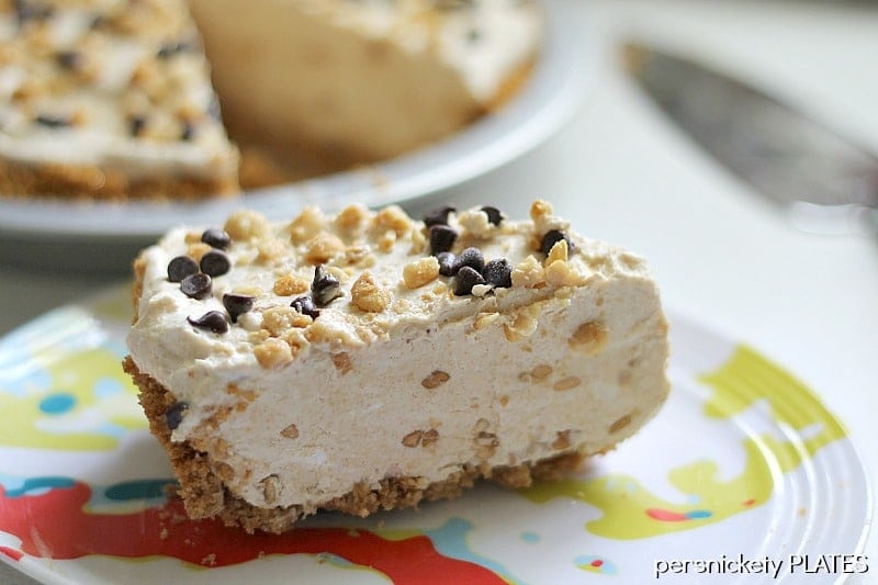 slice of peanut butter pie on a colorful plate.