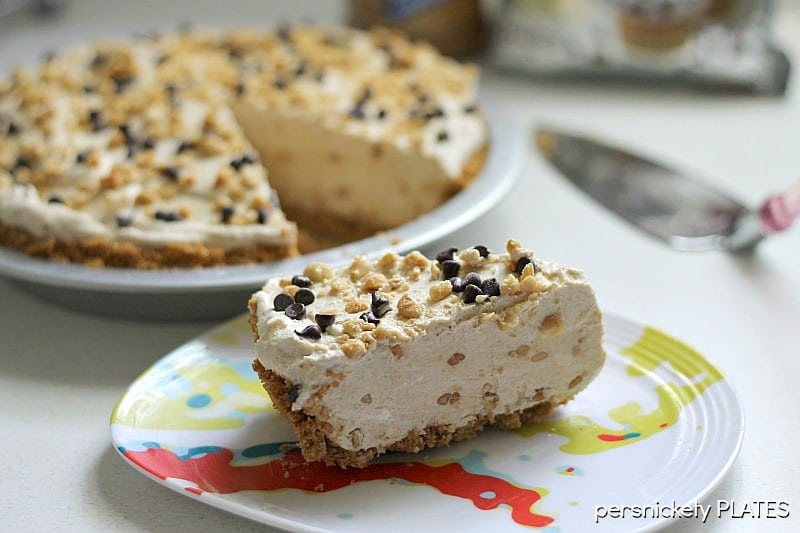 slice of peanut butter pie in front of the entire pie.