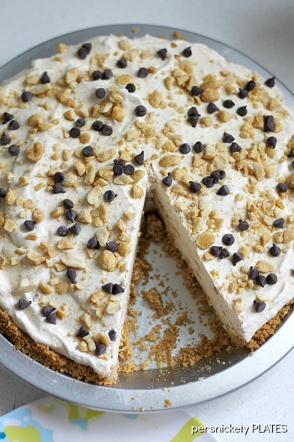 overhead shot of a peanut butter pie with one slice missing.