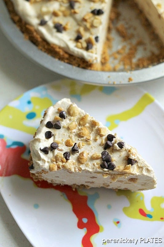 overhead shot of frozen peanut butter pie topped with peanuts and mini chocolate chips.