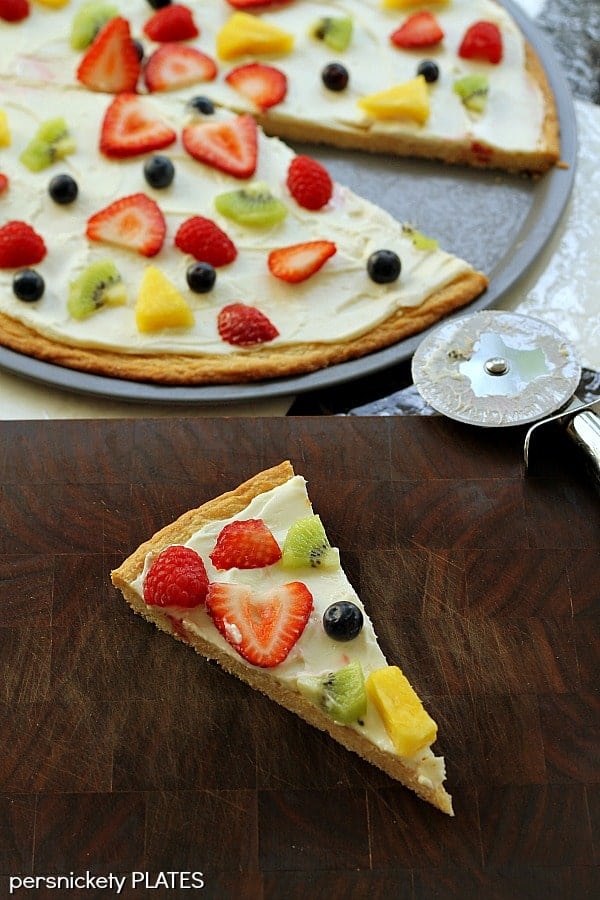 Sugar Cookie Fruit Pizza -a thin sugar cookie "crust" spread with a cream cheese "sauce" and topped with strawberries, raspberries, kiwi, blueberries, pineapple - whatever fruit you love!