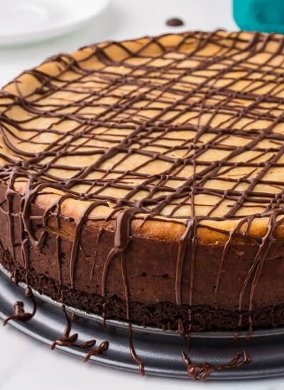 peanut butter brownie cheesecake drizzled with chocolate.
