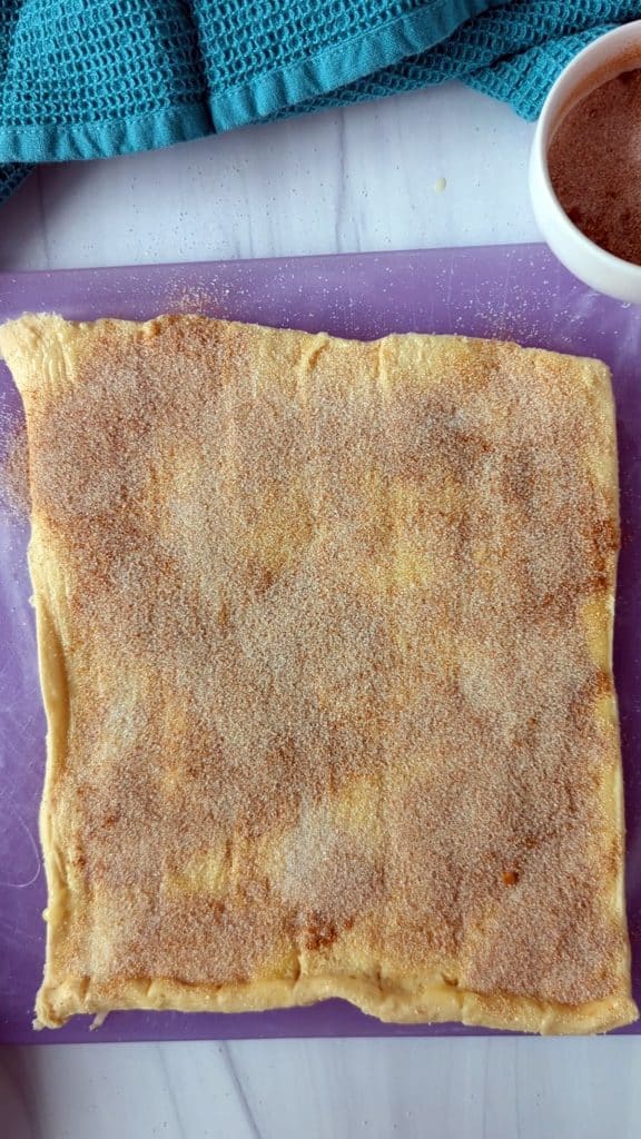 cinnamon & sugar on crescent roll dough.