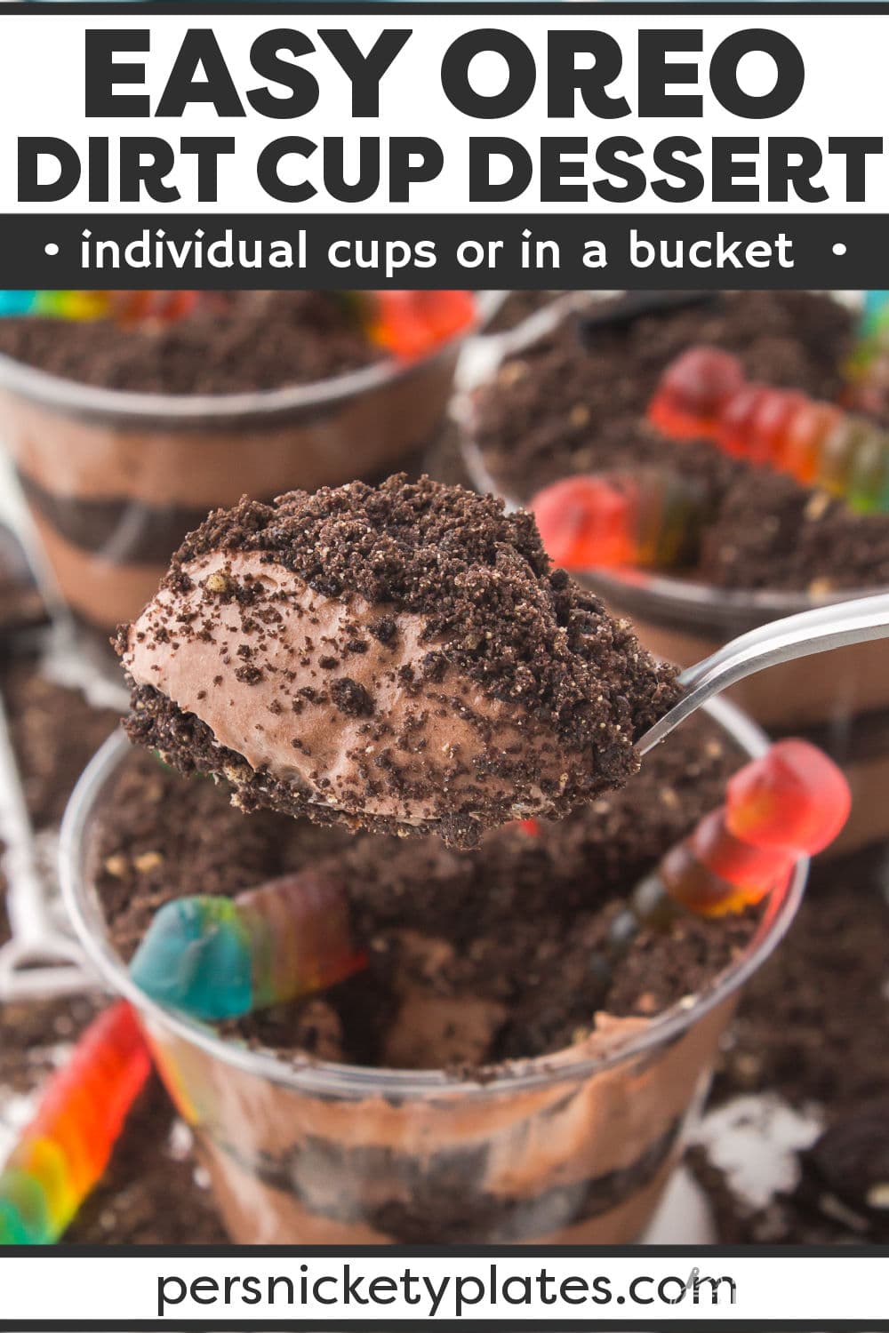 Dirt cup dessert is a fun way to serve a rich, creamy, chocolate pudding! Much like a trifle or parfait, it is layered with crushed Oreo cookies to look like dirt then finished with gummy worms on top! It's a fun and festive dessert that everyone loves. Serve it in individual cups or a bucket for added effect! | www.persnicketyplates.com