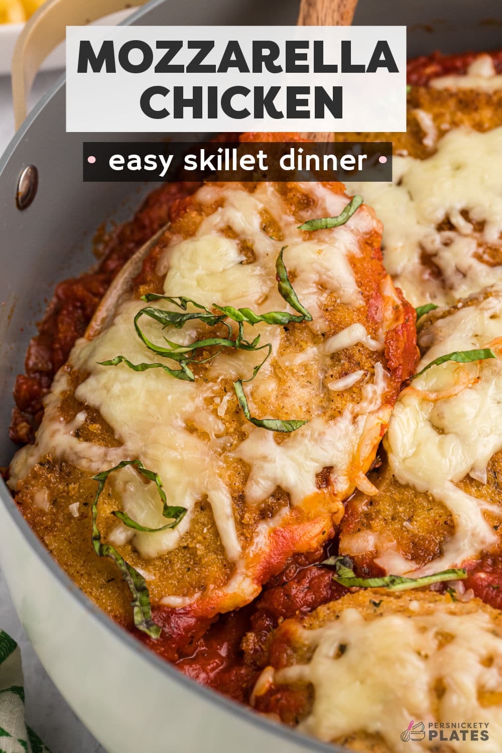 The aroma of this easy mozzarella chicken skillet is enough to have your whole family drooling! Crispy breaded chicken submerged in a rich homemade tomato sauce then smothered in melted mozzarella. This simple weeknight recipe is surprisingly easy to make using simple kitchen staples and is ready to serve with fettuccine in under 1 hour! | www.persnicketyplates.com