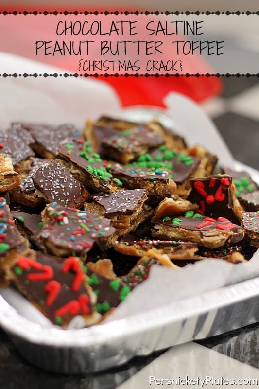 tray full of saltine cracker toffee topped with christmas sprinkles