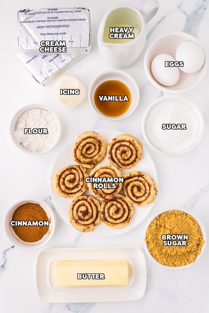 overhead shot of labeled ingredients laid out to make cinnamon roll cheesecake.