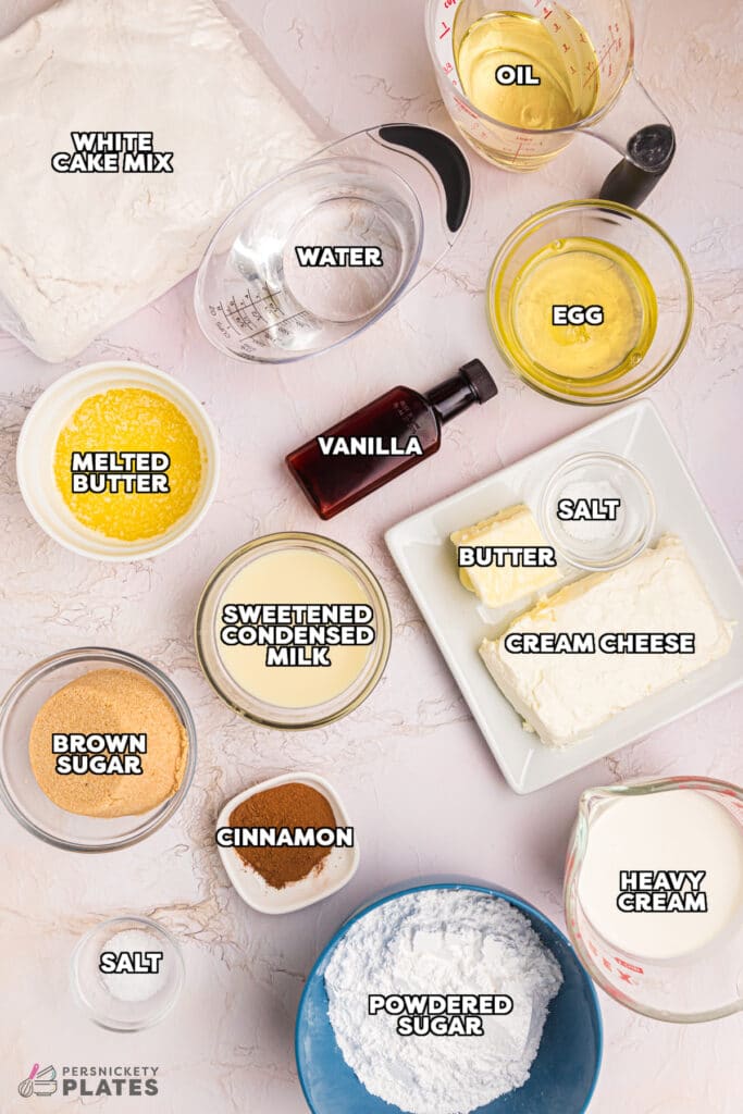overhead shot of labeled ingredients laid out to make a cinnamon roll cake.