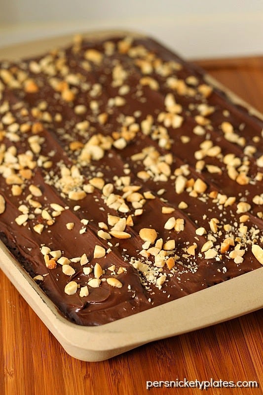 Classic brownies stuffed with Nutter Butters, frosted, then sprinkled with peanuts | Persnickety Plates
