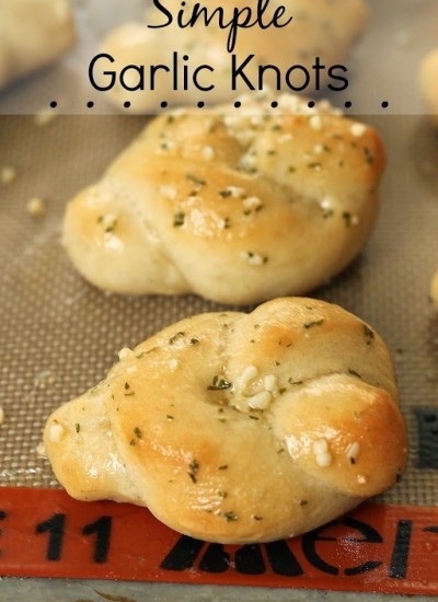 These Simple Garlic Knots are a delicious side dish to a Sunday dinner. Perfect for large gatherings or a quick late night snack, these buttery rolls will disappear quickly!
