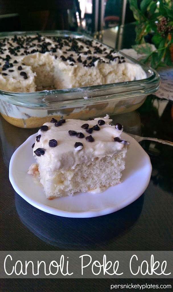 Cannoli Poke Cake - This is a super moist white cake topped with cannoli filling frosting and mini chocolate chips.| Persnickety Plates