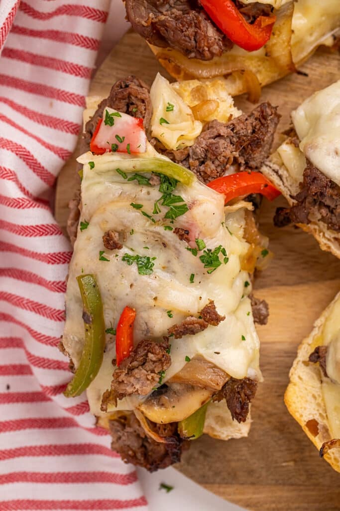 slice of philly cheesesteak bread with peppers & onions.